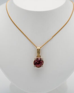 Pendentif or tourmaline rond